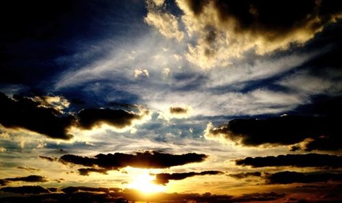 Low angle view of cloudy sky at sunset