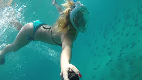 Woman swimming in sea