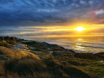 Scenic view of sea against sky during sunset