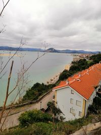 High angle view of houses and buildings against sky