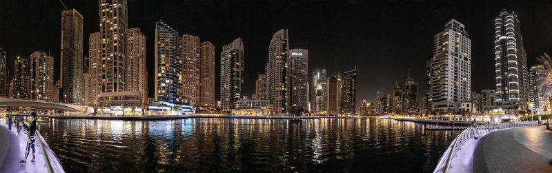 Illuminated buildings in city at night