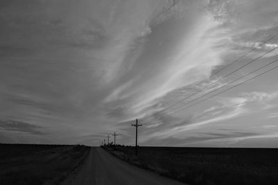 Road by landscape against sky