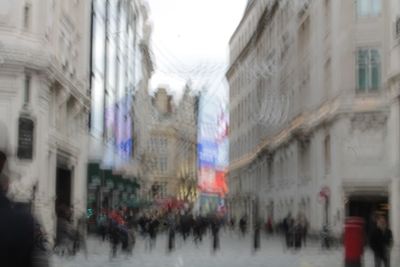 People walking in front of buildings