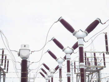 Low angle view of street lights against clear sky