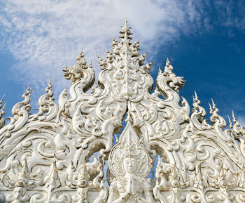 Low angle view of statue against sky