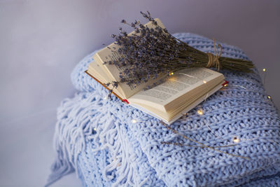 High angle view of cross on book