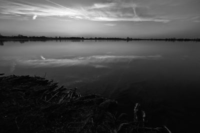 Scenic view of lake against sky during sunset