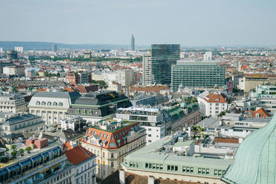 High angle view of city buildings against sky