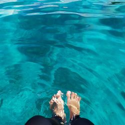 Low section of woman in swimming pool