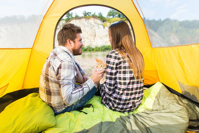 People sitting in tent