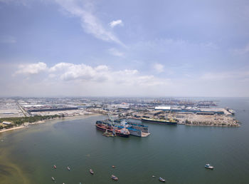 High angle view of harbor by sea against sky