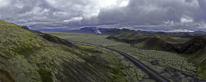 Panoramic view of landscape against cloudy sky