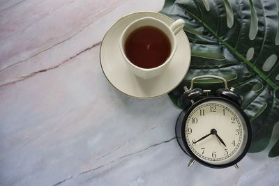 High angle view of clock on table