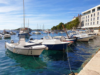 Boats moored at small harbor located at hvar, croatia