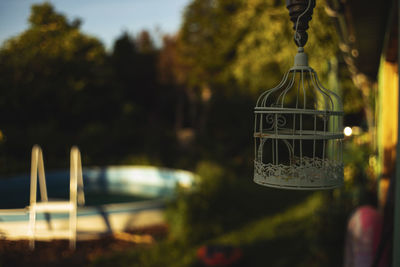 Close-up of illuminated lighting equipment hanging at yard