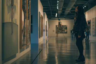 Full length of woman standing in museum