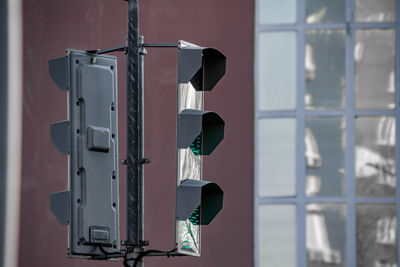 Modern city traffic light regulates traffic green light