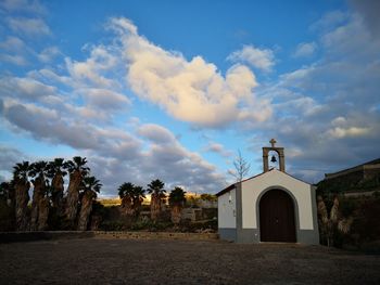 View of trees and buildings against sky