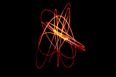 Close-up of light painting against black background