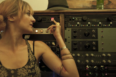 Portrait of a young woman in a recording studio