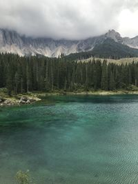 Scenic view of lake against cloudy sky