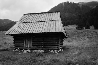 Hut on grassy field