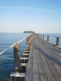 Pier over sea against sky