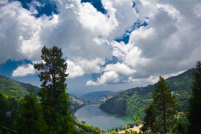 Scenic view of river amidst mountains against sky
