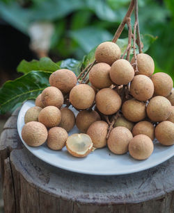 Close-up of longan in plate on table