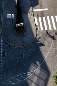 High angle view of man shadow on blue floor