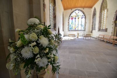 White flowers against wall in church