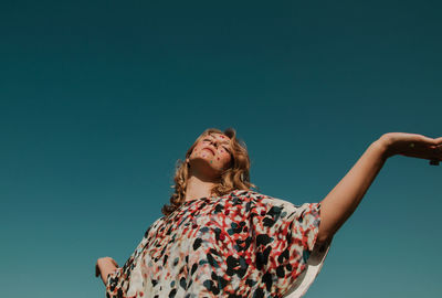 Woman with make-up against clear sky