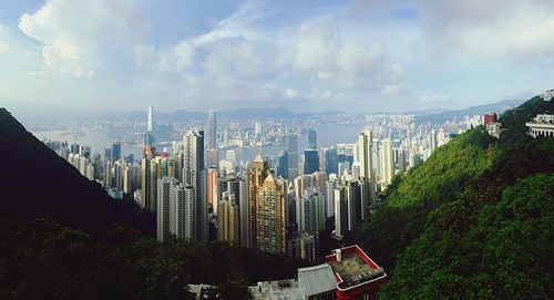 Panoramic view of buildings in city against sky