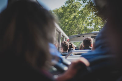 Rear view of people traveling in bus