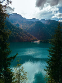 Scenic view of lake and mountains against sky