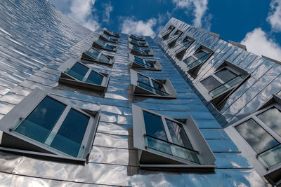 Low angle view of modern building against sky