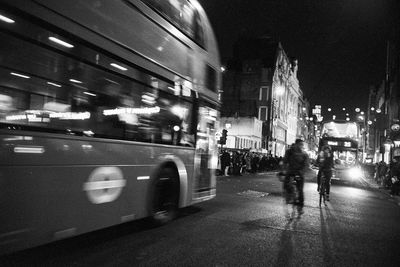 Blurred motion of car on illuminated city at night