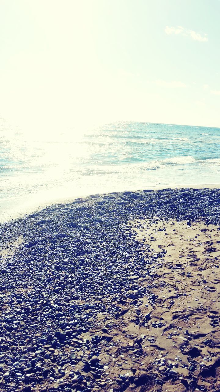 sea, horizon over water, water, beach, scenics, tranquil scene, tranquility, beauty in nature, shore, sand, sky, nature, wave, idyllic, coastline, remote, day, outdoors, sunlight, no people