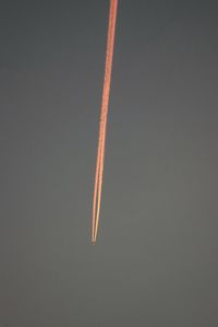 Low angle view of airplane flying against sky