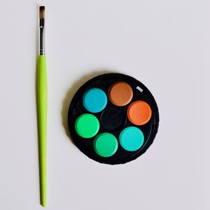 Directly above shot of multi colored candies against white background