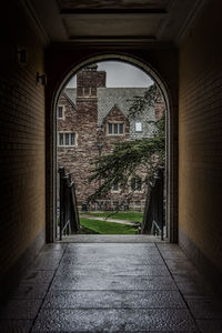 Old building seen from archway