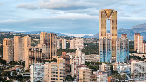 High angle view of buildings in city against sky