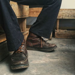 Low section of men sitting on floor