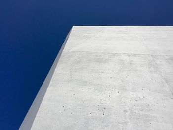 Low angle view of building against clear blue sky