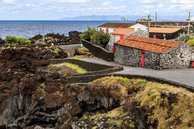 High angle view of building by sea against sky