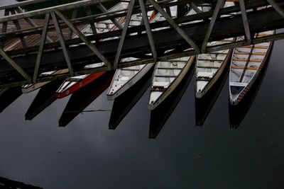 High angle view of sailboats moored in lake