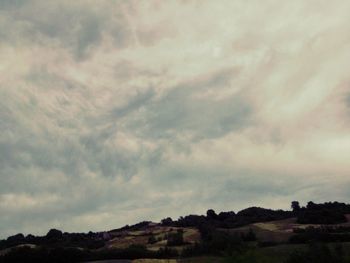 Scenic view of landscape against cloudy sky