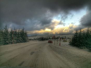 Scenic view of landscape against cloudy sky