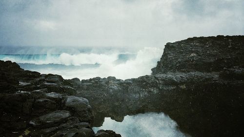 Waves splashing on rocks