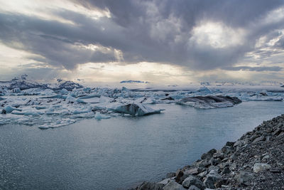 Idyllic jokulsarlon glacier lagoon against dramatic sky during sunset
